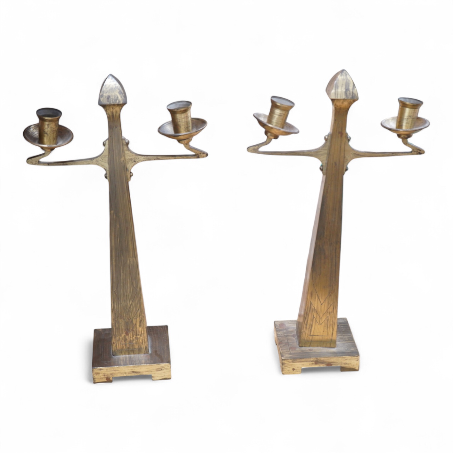A pair of Jugendstil Arts and Crafts brass two branch candelabra, 37cm high
